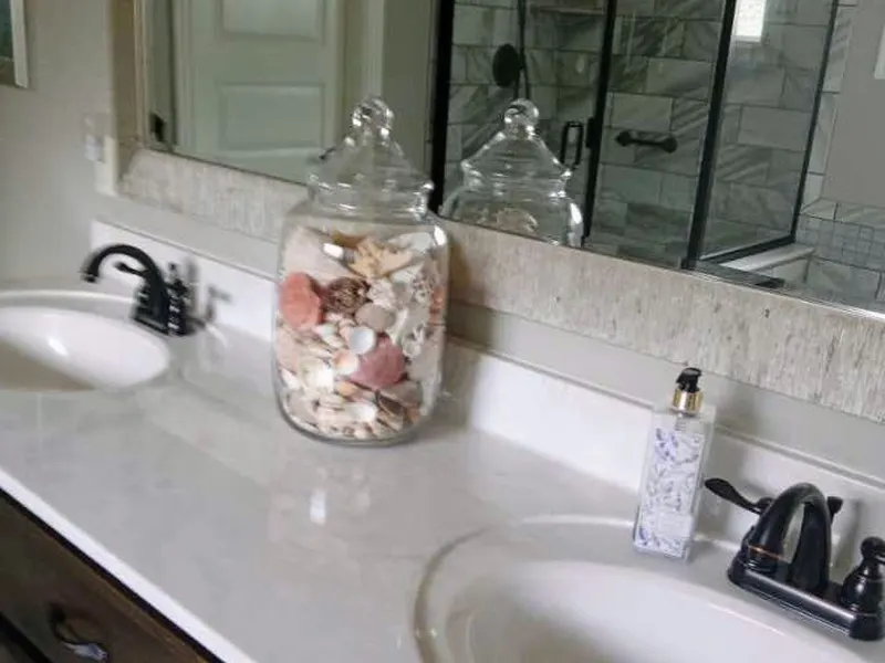 A bathroom vanity and mirror after a clean